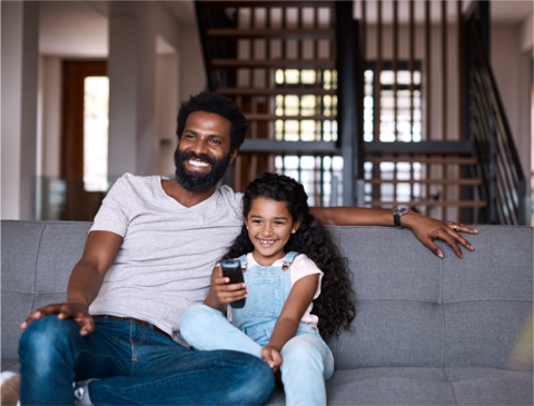 Father and daughter watching tv