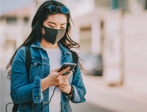 Girl wearing mask on phone