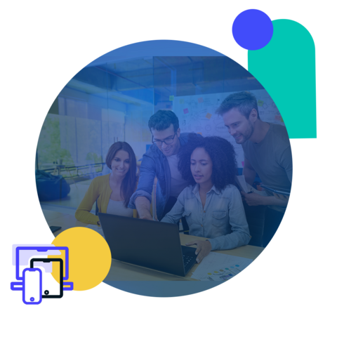 A group of four people are gathered around a laptop in an office space.