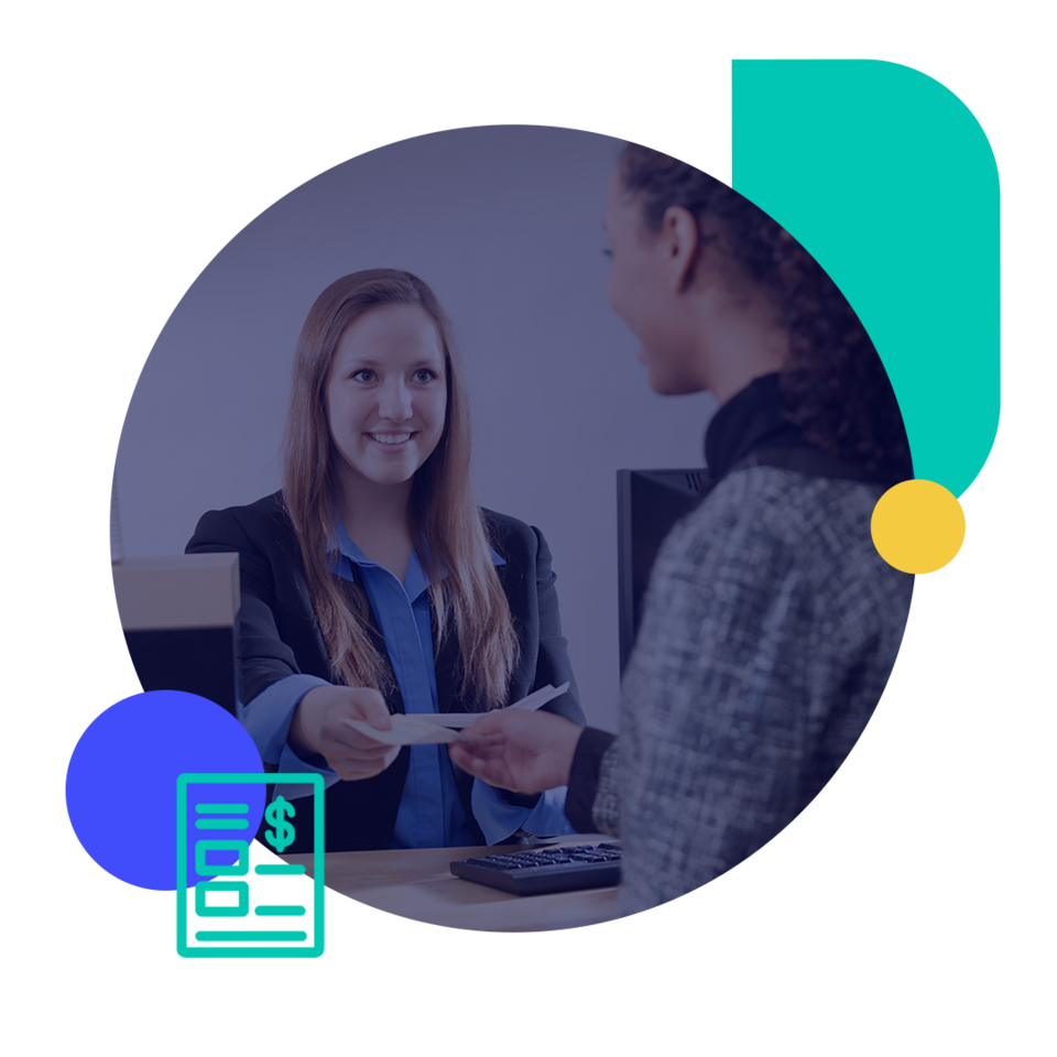 A teller at a bank hands a check to a customer.