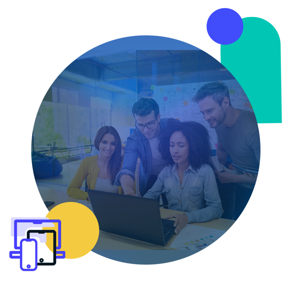 A group of four people are gathered around a laptop in an office space. 