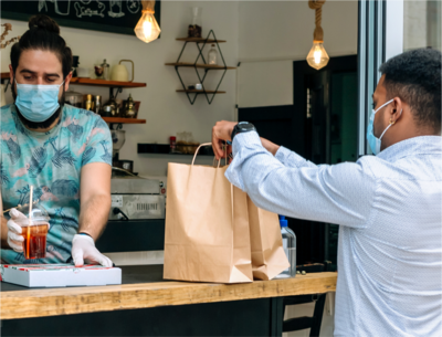 Man getting takeout in mask