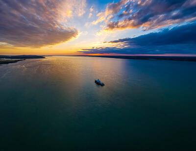 ship traveling through channel