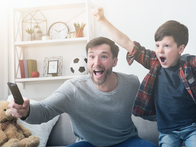 Father and son watching cheering